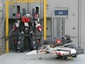 Armored VF-1J and Super Pack VF-1S in repair bay